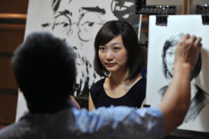 artist drawing live model