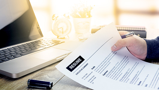 someone holding a resume