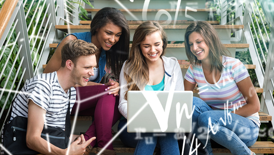 students doing math on a laptop