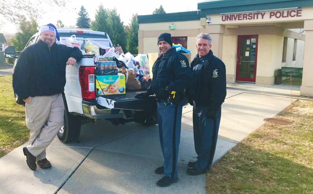 Police with a truck filled with food