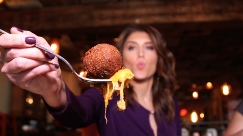 Woman eating meatball