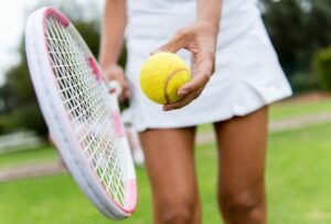 woman with tennis racquet and ball 2