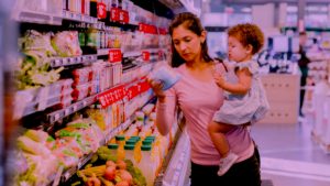 Young mother grocery shopping